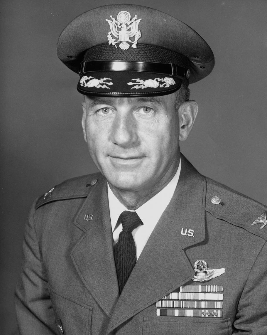 A black and white photo, reflecting its age, of a man in a military uniform. 