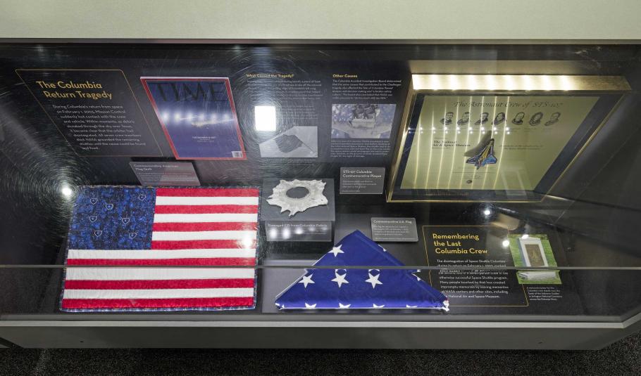 A display case in the Moving Beyond Earth exhibition, commemorating the Columbia return tragedy.