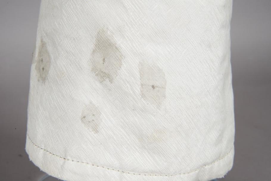 Close up detail of grey spots on Armstrong's Apollo 1 glove. 