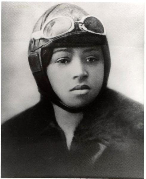Portrait of Bessie Coleman with a pilot headgear and goggles