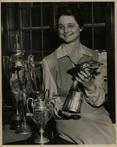 Louise Thaden poses with a trophy.