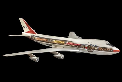A model of the Boeing 747 jet airliner, with a cut away section revealing the seats. 