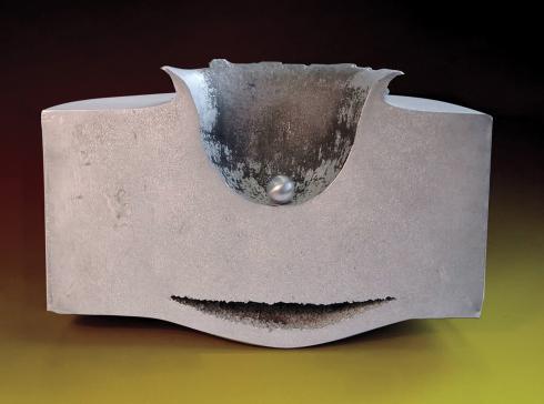 A marble-sized object created a deep crater in a piece of concrete during a lab test to demonstrate how even small orbital debris can cause severe damage to spacecraft.