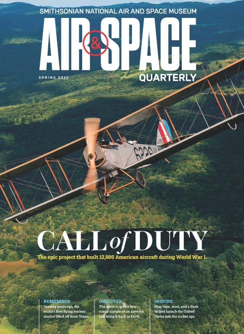 Magazine cover featuring a vintage aircraft in flight over a lush forested landscape. lan