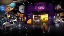 A rendering of a gallery showing planetary information. There are planets hanging from the ceiling and a purple wall in the center.