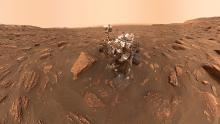 NASA's Curiosity Mars rover on the rock Mars surface.