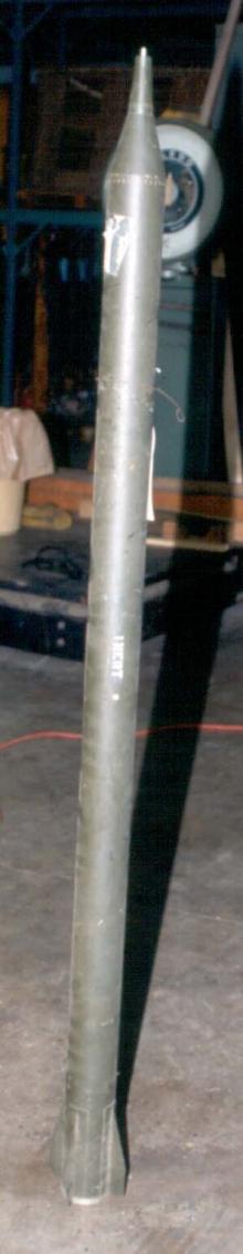 A small rocket in an interior facility.