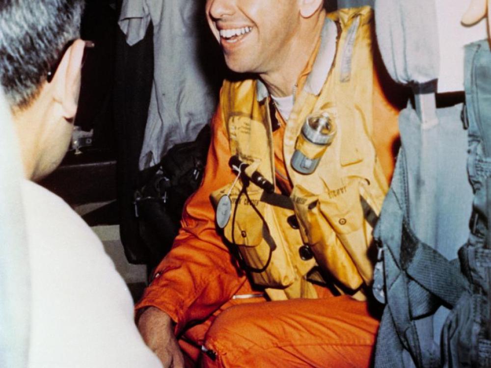 Alan Shepard onboard a helicopter as he is transported from the aircraft carrier following Freedom 7 splashdown