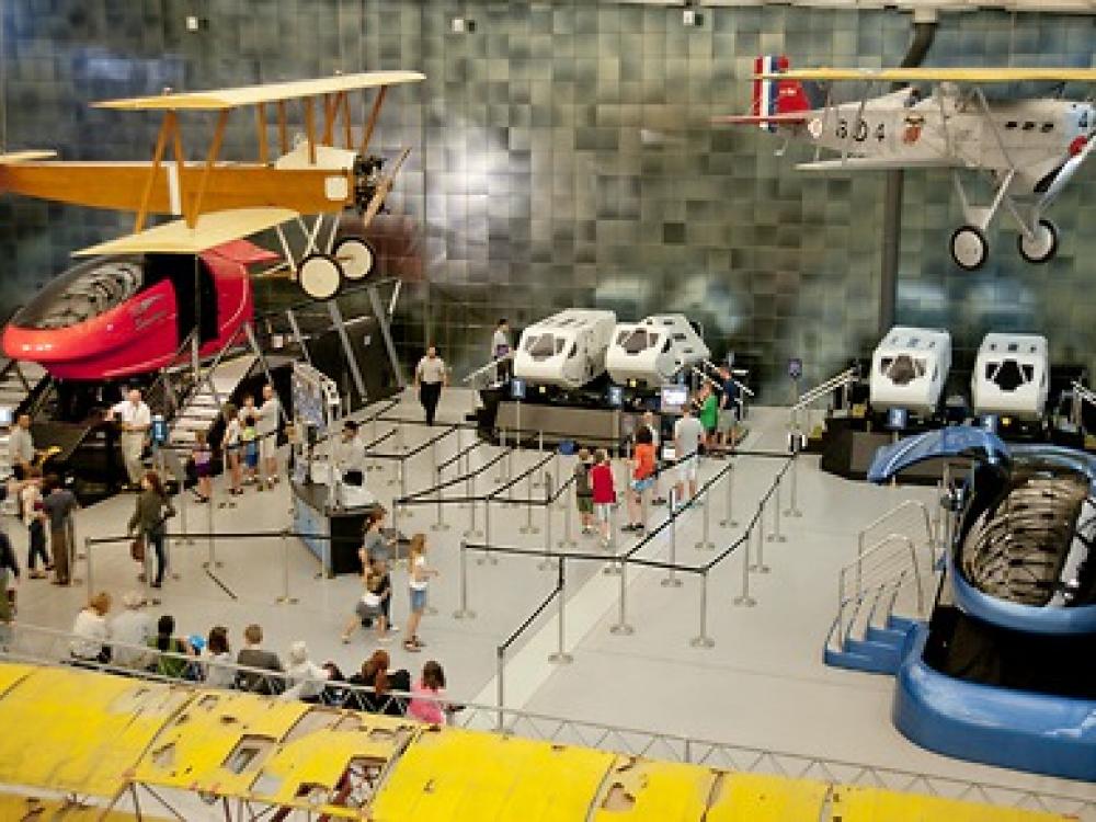 A view from above shows visitors waiting in line for simulators at the Steven F. Udvar-Hazy Center.