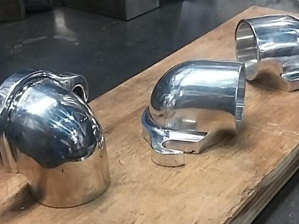 Three fully shaped and polished aluminum intake elbows