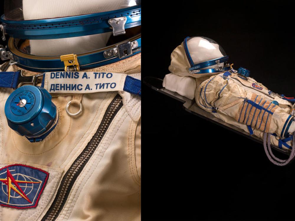 Side by side images of suit Dennis Tito wore when he launched to the International Space Station. On the left is a close-up of the suit when his name tag visible and the right, a full-figured suit from a sidle angle.