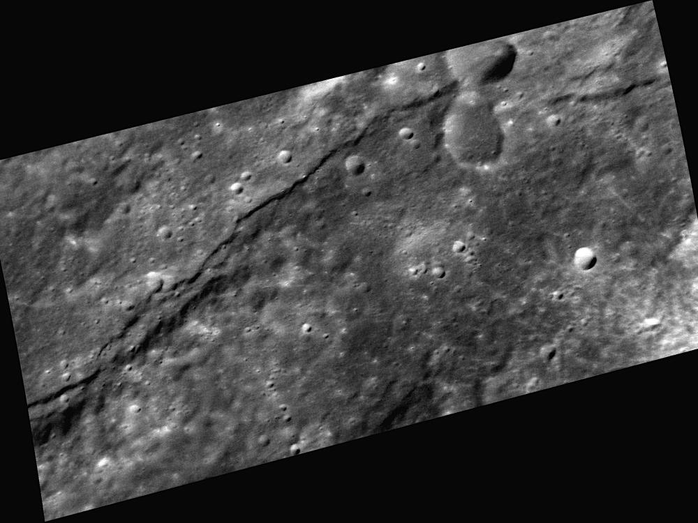 A scarp, or steep cliff, extends horizontally through this image of Mercury's surface.