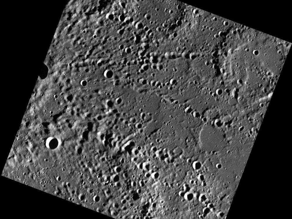 An image of Mercury's surface dotted with craters.