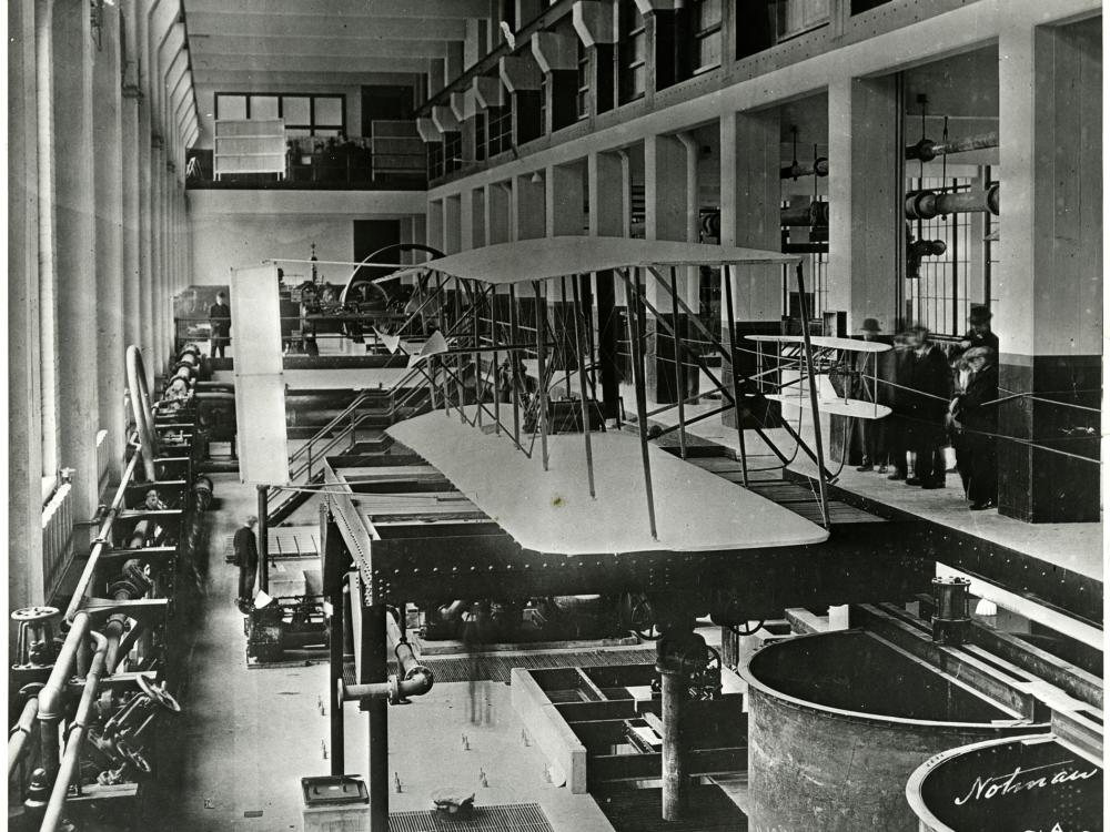 One-quarter rear right side view from slightly above of the Wright 1903 Flyer hanging on exhibit.