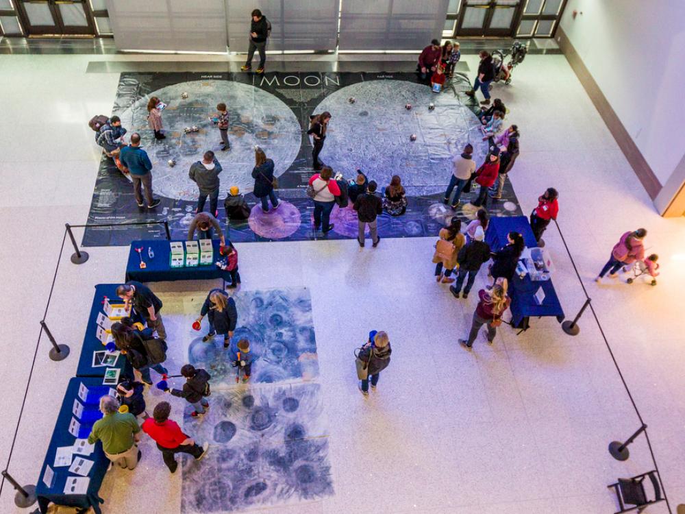 An activity that involves a map of the Moon on the floor. 