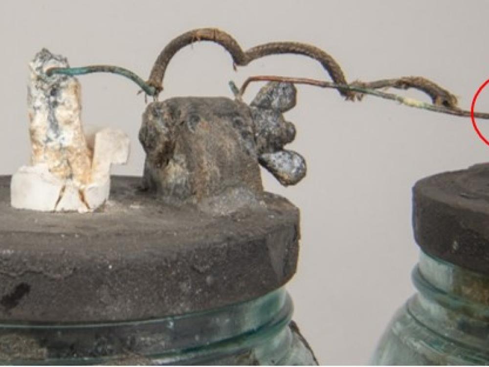 A closeup of a top of a jar with old wiring compared to another image of a closeup of the wiring.