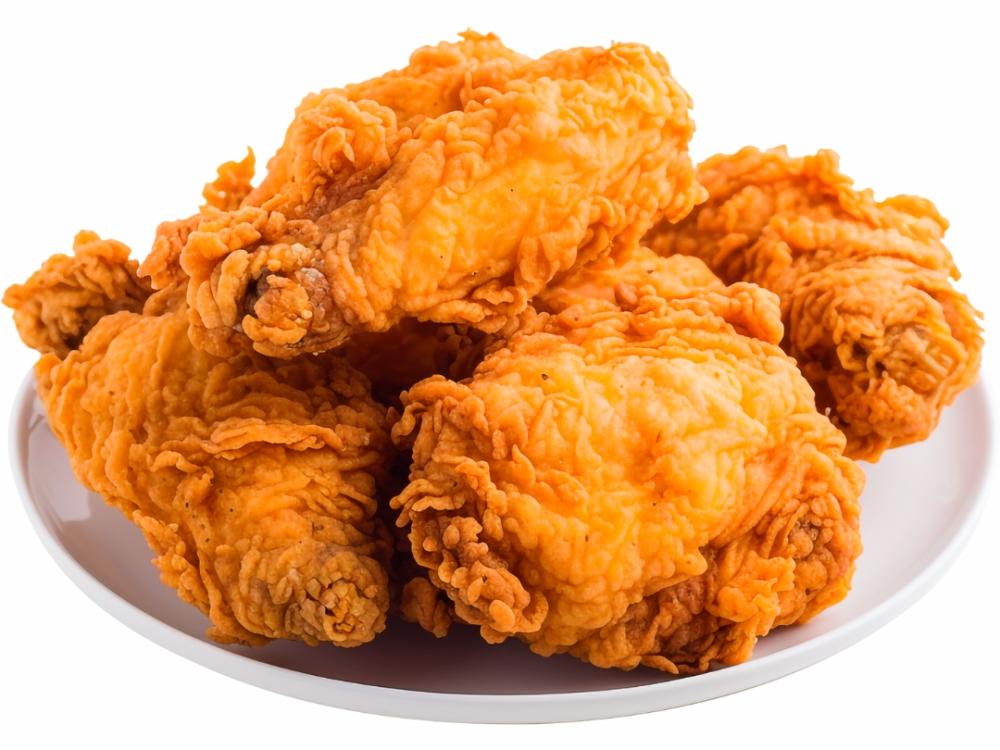 Four pieces of fried chicken on a plate.