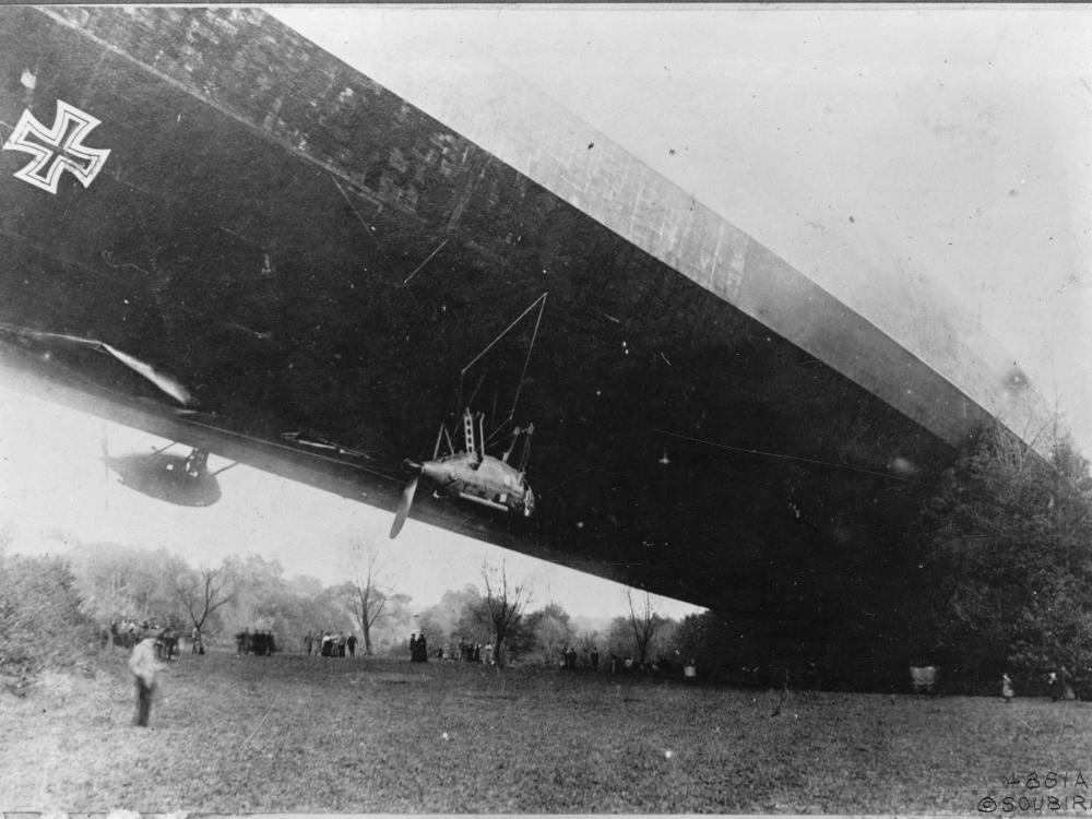 An airship with one end on the ground and the other end still floating above it.