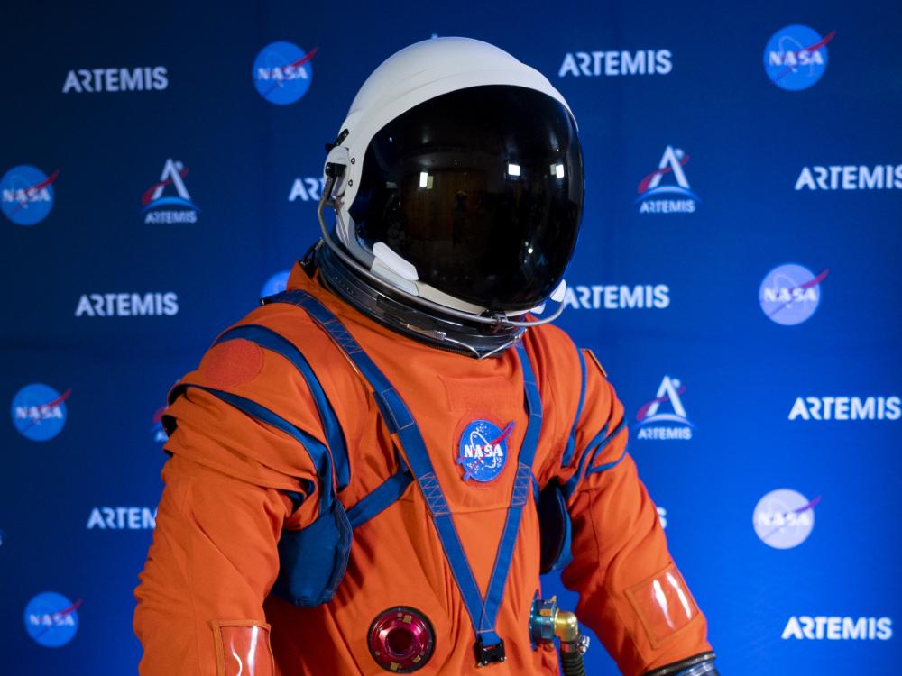 An orange spacesuit with a white helmet and black screen.