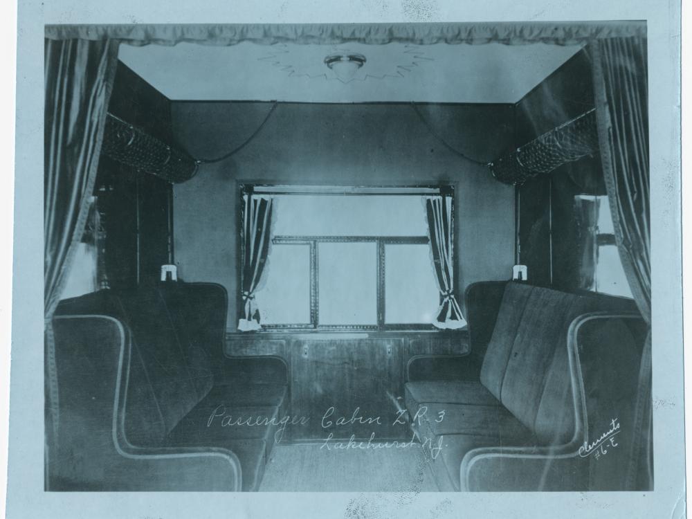 "Passenger Cabin ZR-3, Lakehurst, N.J." Interior view looking toward window of a passenger cabin on board the US Navy airship ZR-3 "Los Angeles," taken while the airship was docked at NAS Lakehurst, N.J.; circa 1923-1925. (Smithsonian National Air and Space Museum, NASM 9A19811.)