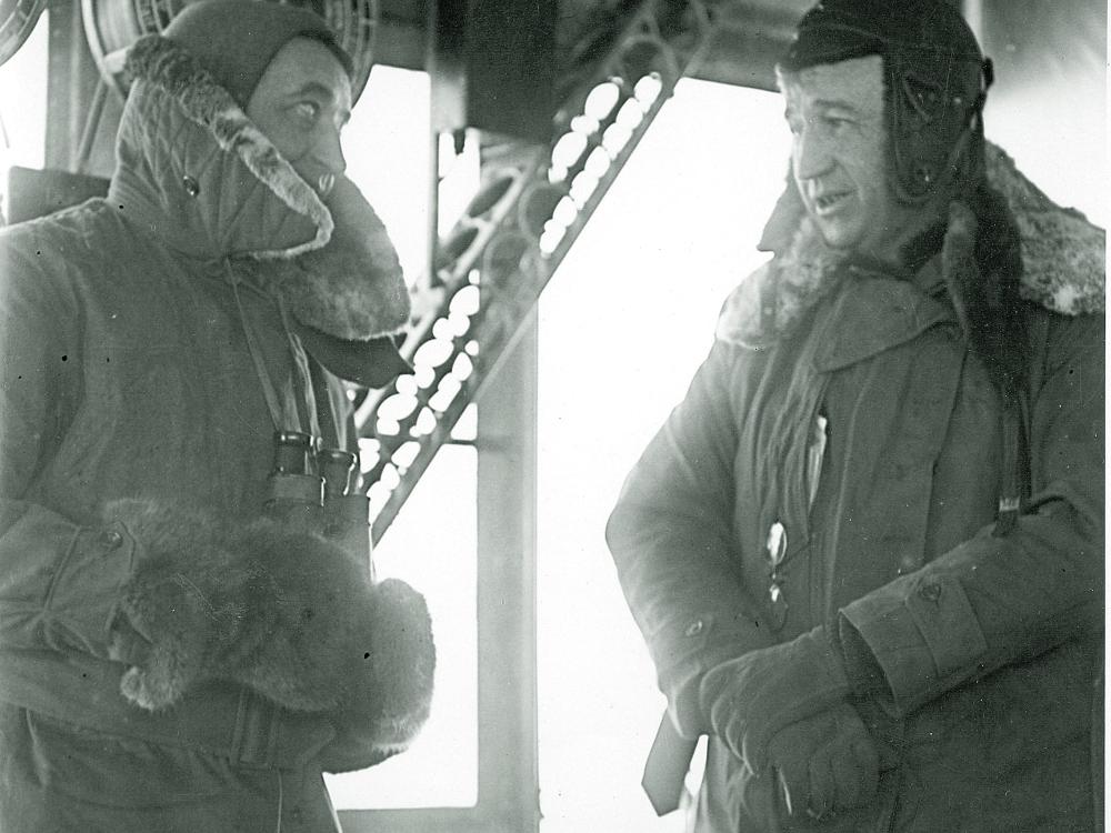 Portrait of Cmdr. J. H. Klein, U.S. Navy, and Capt. E. T. Pollock, U.S. Navy, in the control car of U.S. Navy airship ZR-3 Los Angeles after observation of an eclipse in 1925.