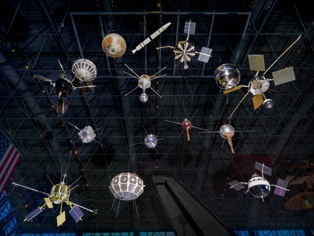 Set of 15 satellites of different shapes and sizes hanging from the ceiling