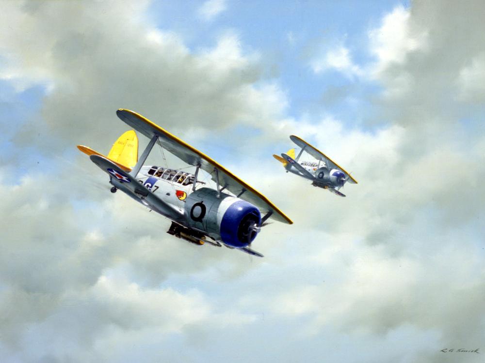 Two biplanes in flight against a cloudy blue sky, with yellow accents and visible insignia. 