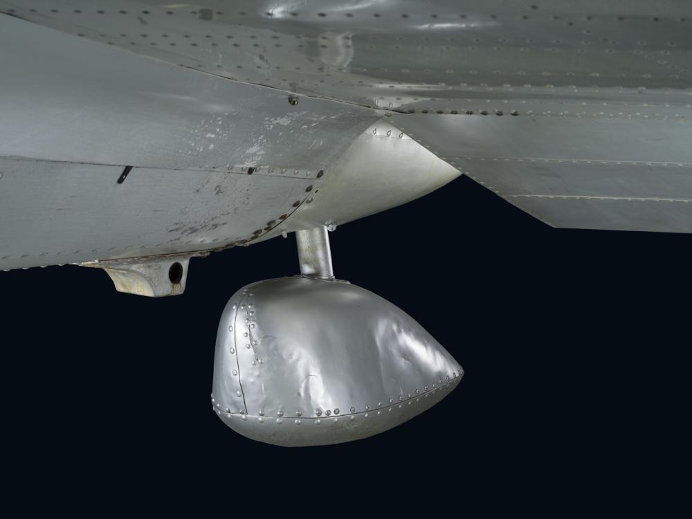 Round bulb-shaped metal rear landing ski on bottom of Northrop Gamma Polar Star aircraft