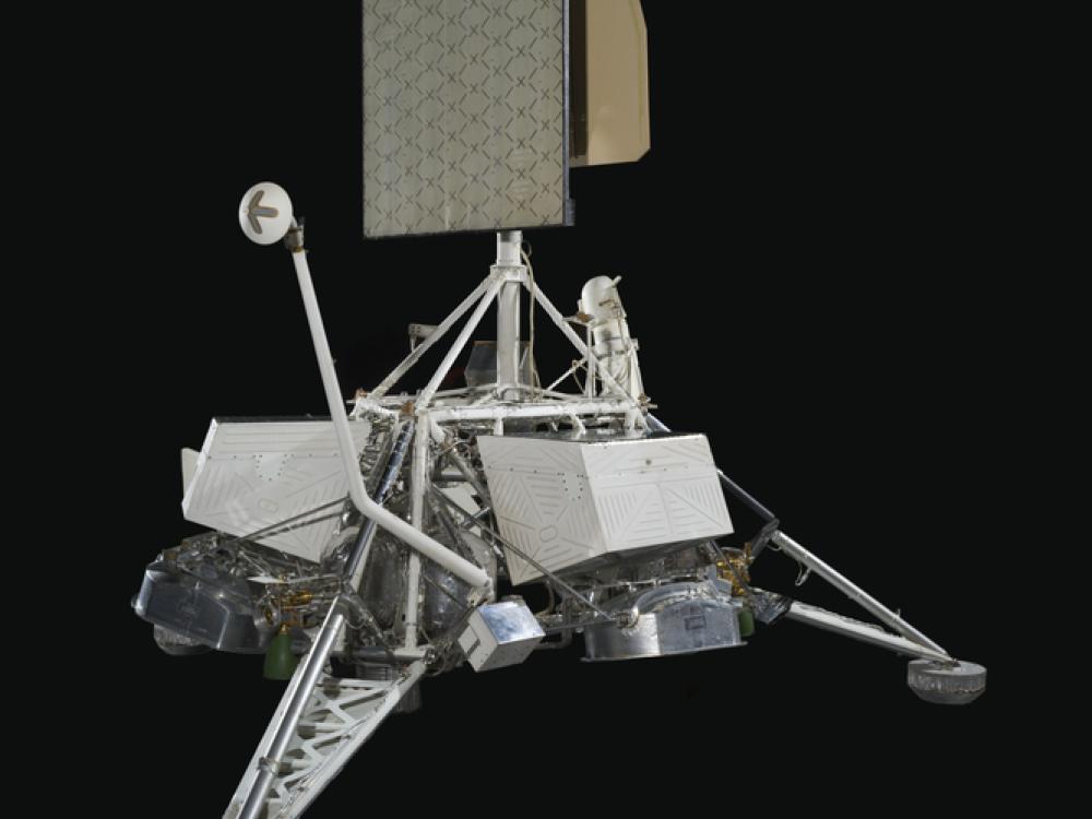 View of a spacecraft with solar panels on top.