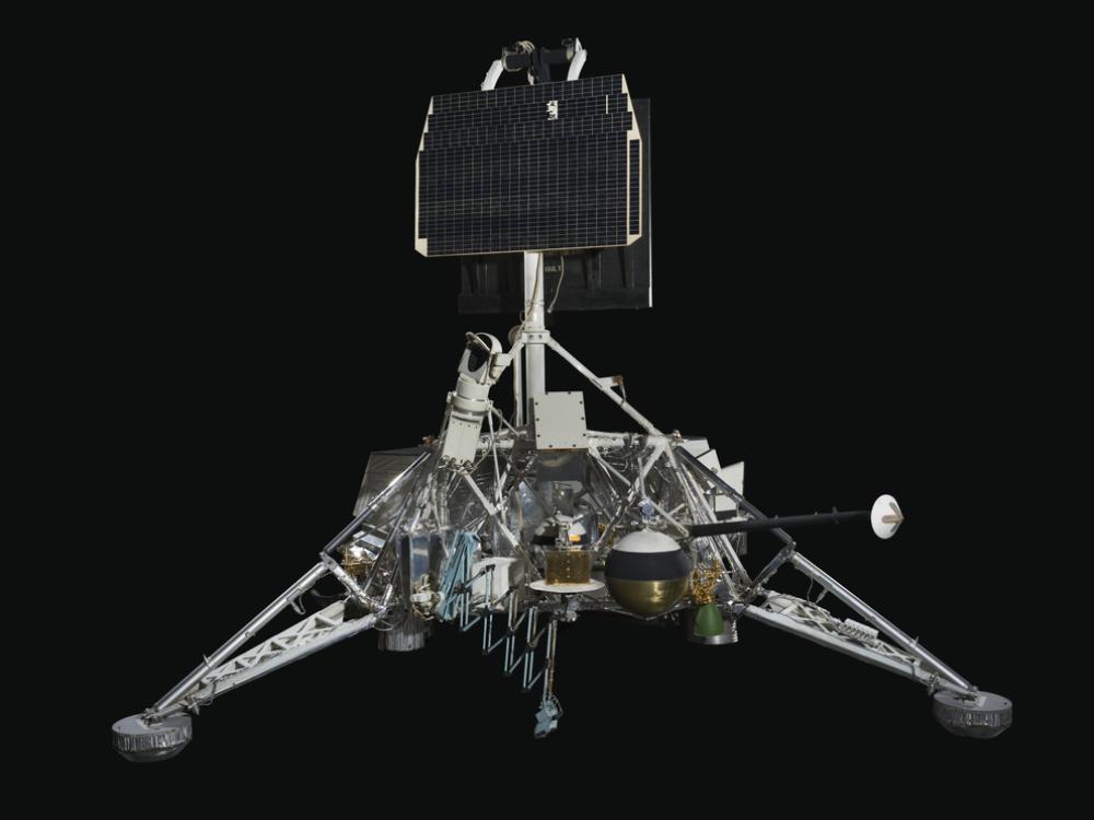 View of a spacecraft with solar panels and a gas tank.