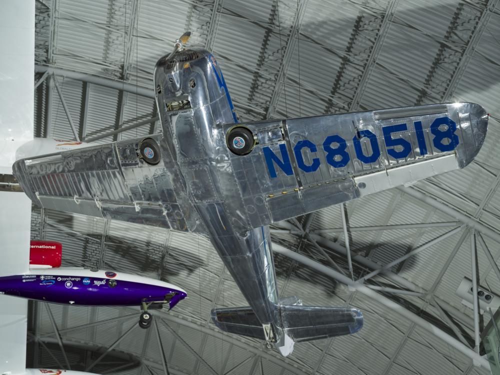 Underbelly of a silver painted plane. 