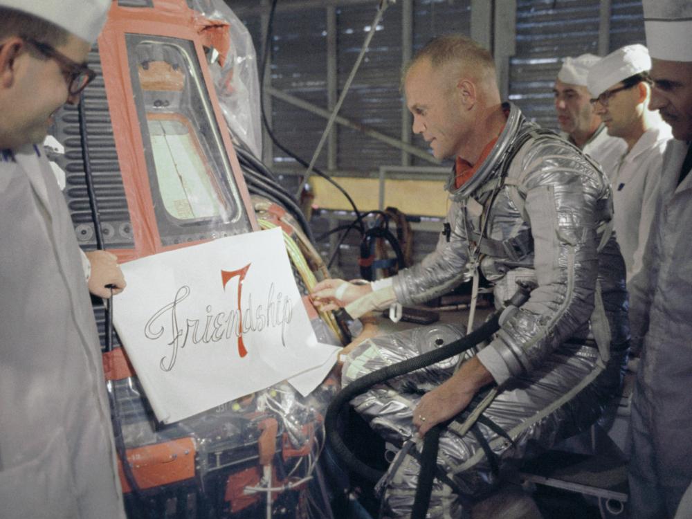 Astronaut John Glenn Inspecting the Placement of the "Friendship 7" Name