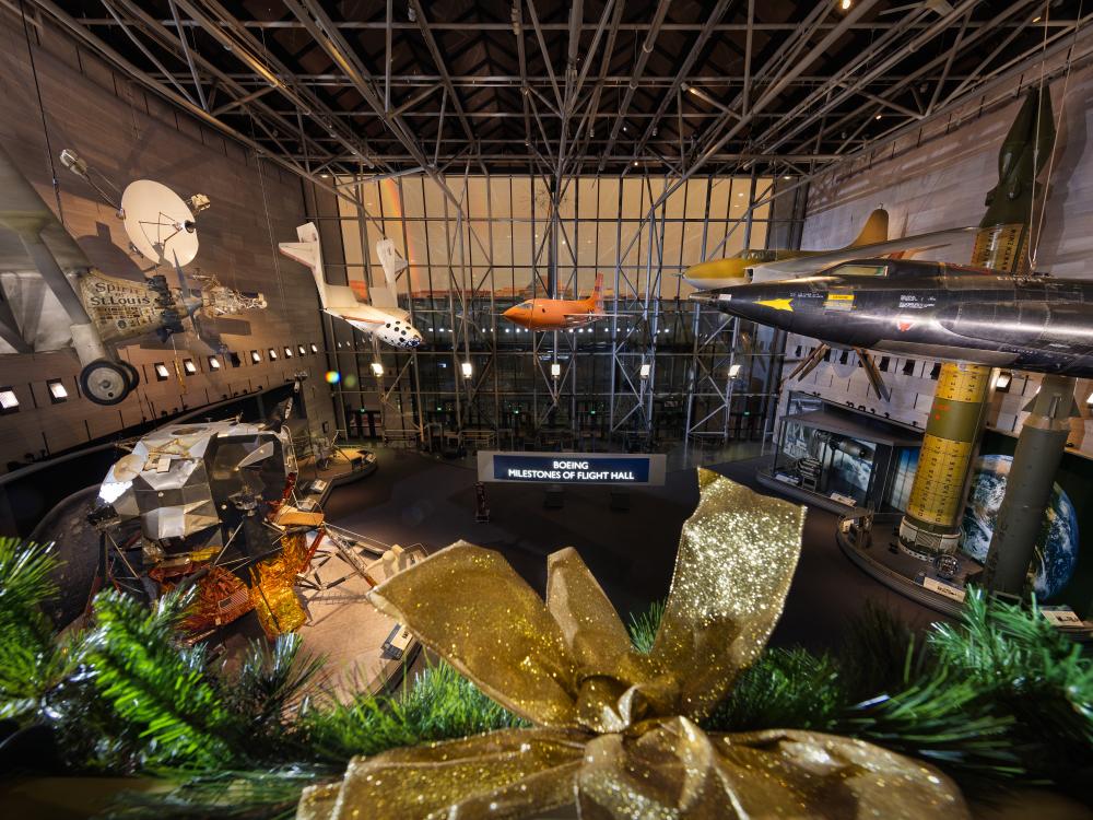 Image of the Museum's entry gallery from the second floor. A rainbow can be seen outside. 