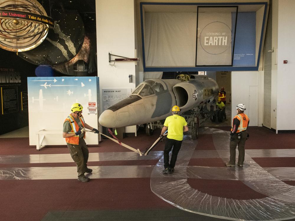 Contractors hand-tow the Lockheed U-2 fuselage.