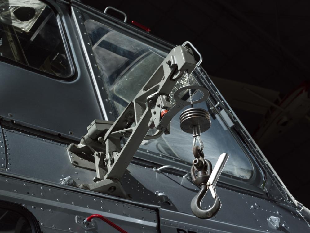 View of a cargo hook attached to a helicopter.