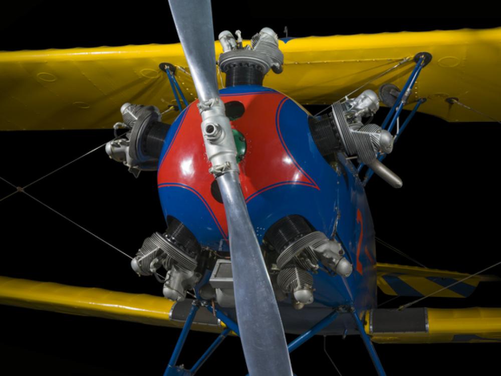 Propellers painted to a yellow and blue biplane. 