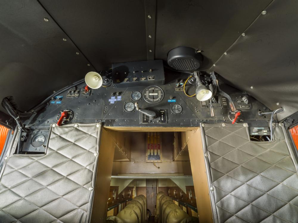 View of a instrument panel leading to the cabin of the plane. 