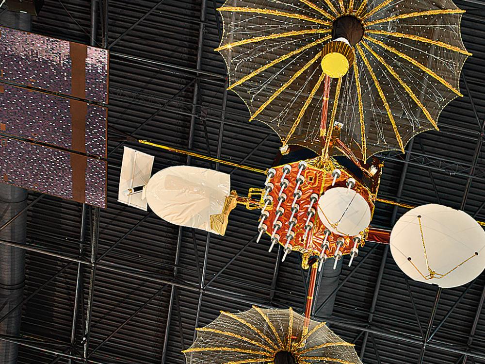 A satellite device with panel and umbrella shaped modules.