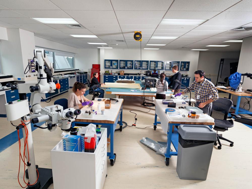 Two conservators work in the lab. 