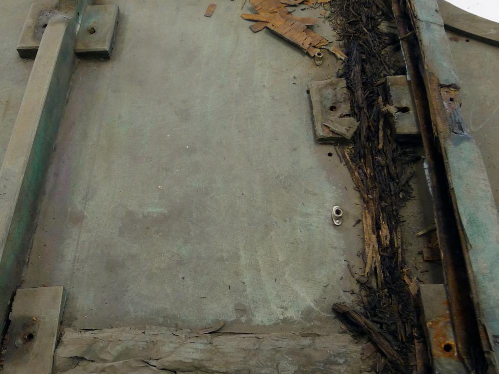 A section of lumber on a World War II era aircraft. The outer section of lumber is mostly intact, whereas the inner section of lumber on the right is rotted.