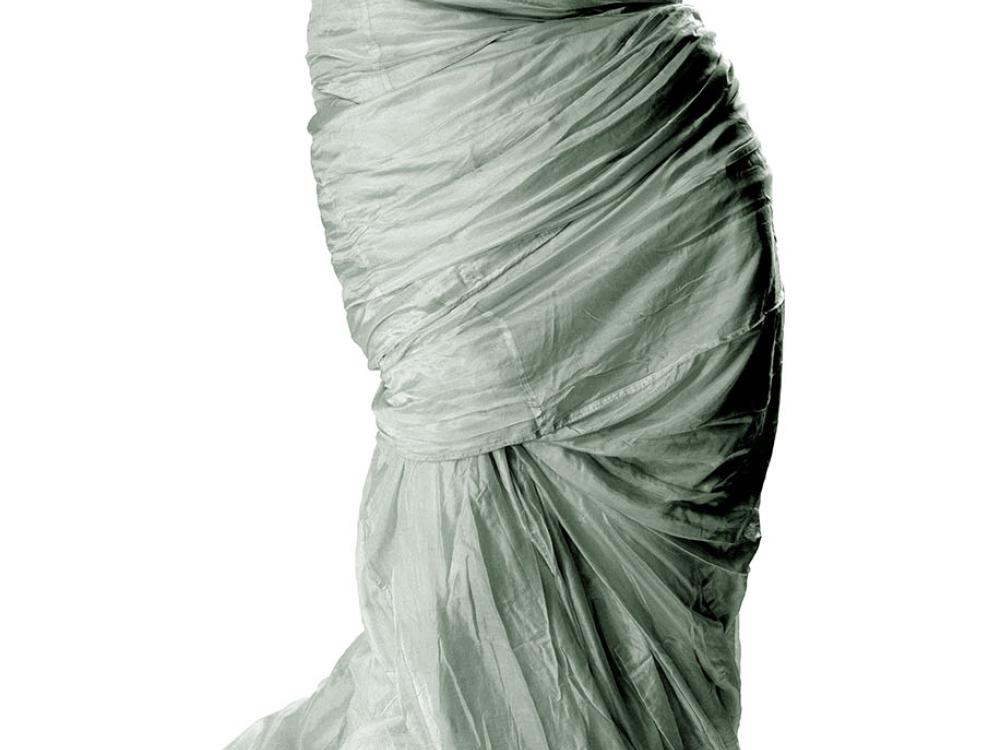 Large grey-colored parachute made with 110 yards of silk. The parachute was made with straight pieces of material.