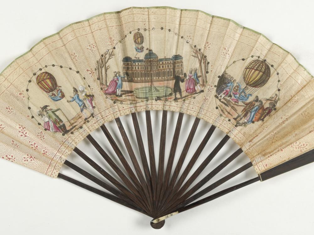 Decorative fan with three pieces of artwork depicting the first hydrogen balloon. 