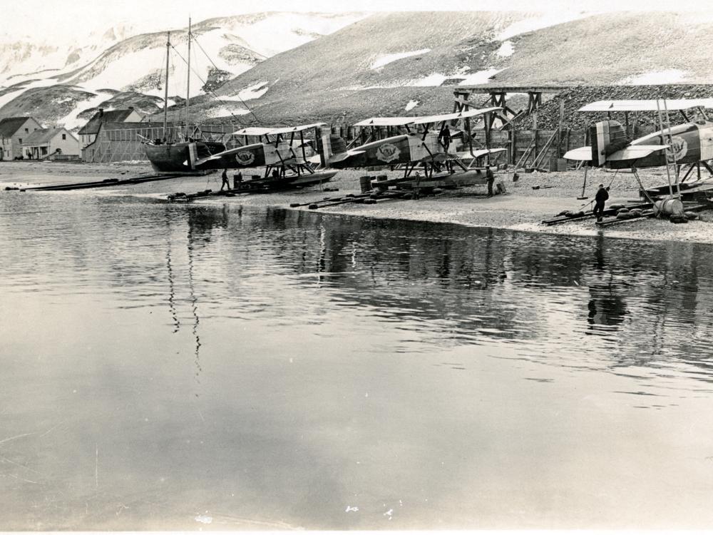 A view of the three remaining Douglas World Cruisers parked on a shore belonging to Alaska.