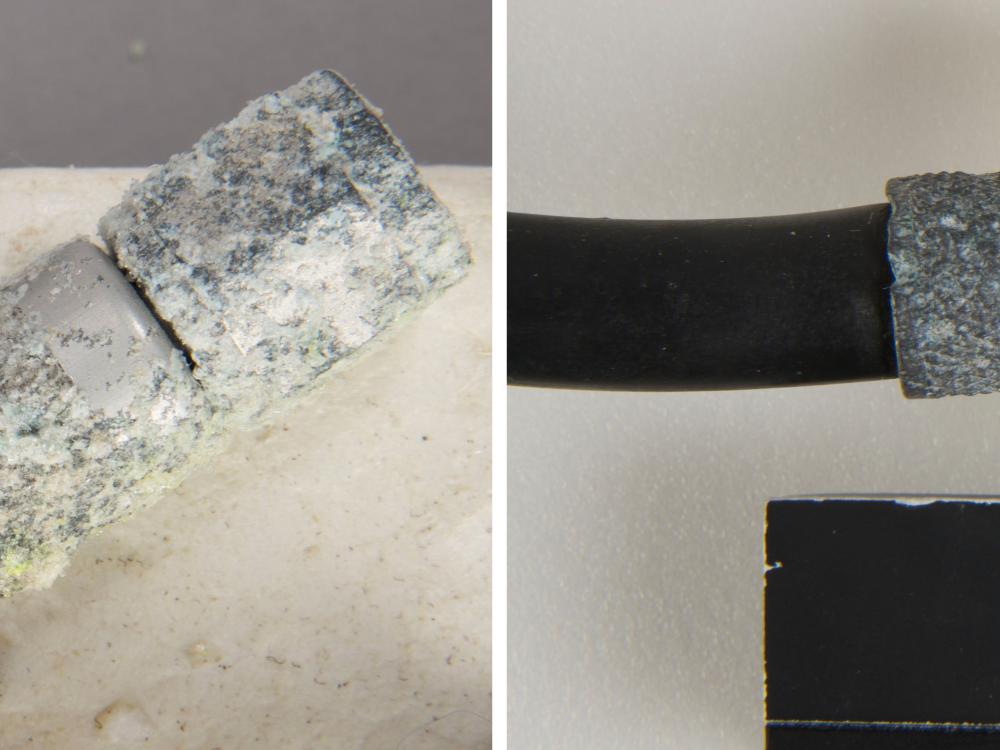 Comparison views of a microphone connector before and after conservation treatment. On the left, the connector has not received conservation treatment and is showing signs of corrosion based on its white appearance. On the right, conservation treatments have been performed and the connector has a mostly gray appearance.