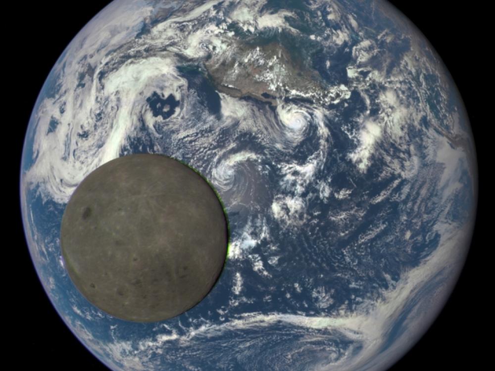 A view of the dark side of the Moon as the Moon passes Earth in front of an observatory spacecraft.