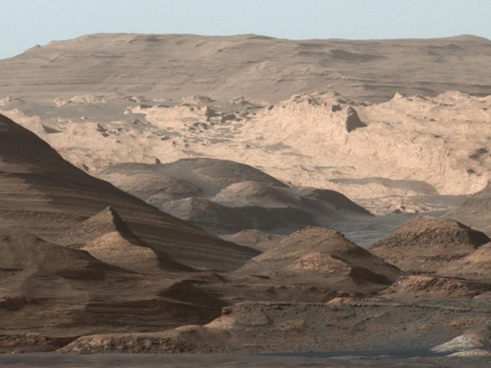 Panoramic view of a higher-altitude mountain landscape on Mars.