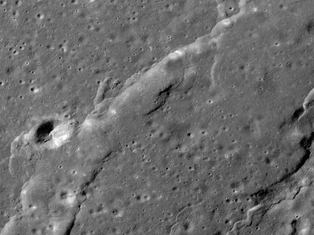 Small areas of troughs created from stretching lunar crust on the Moon. They are most visible in the upper half of the perspective.