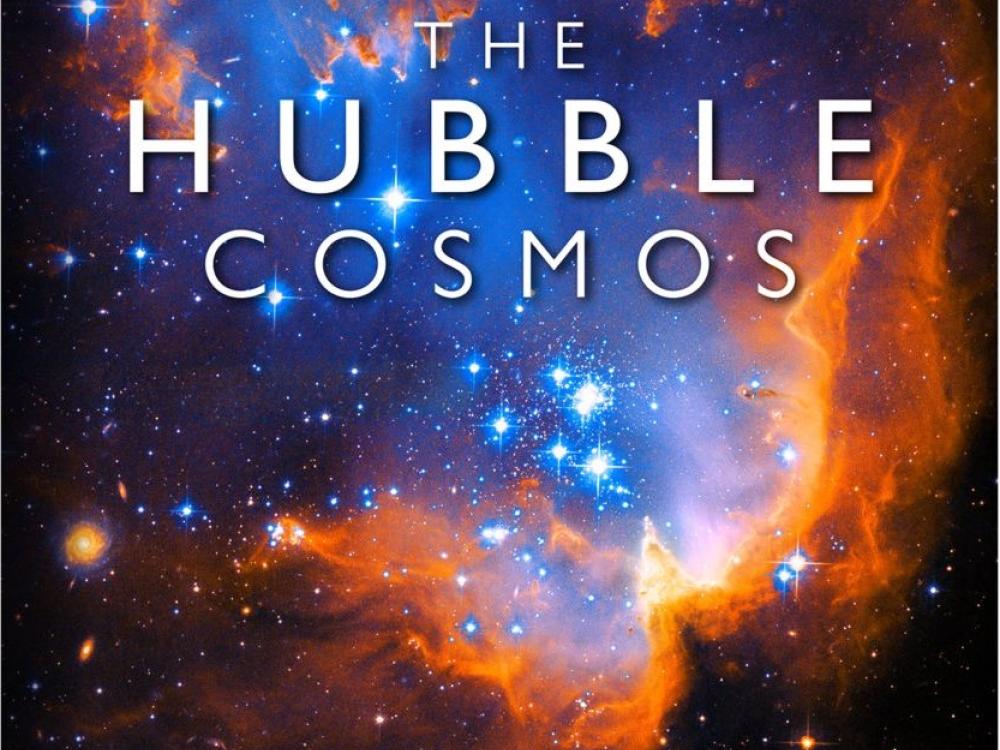 Book cover that features an red, orange, and blue nebula spotted by the Hubble Space Telescope.