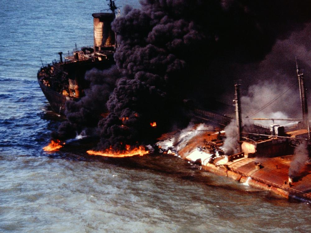 Disaster scene in the Gulf of Mexico, where two ships, one carrying 300,000 tons of crude oil, collided and started a massive fire.