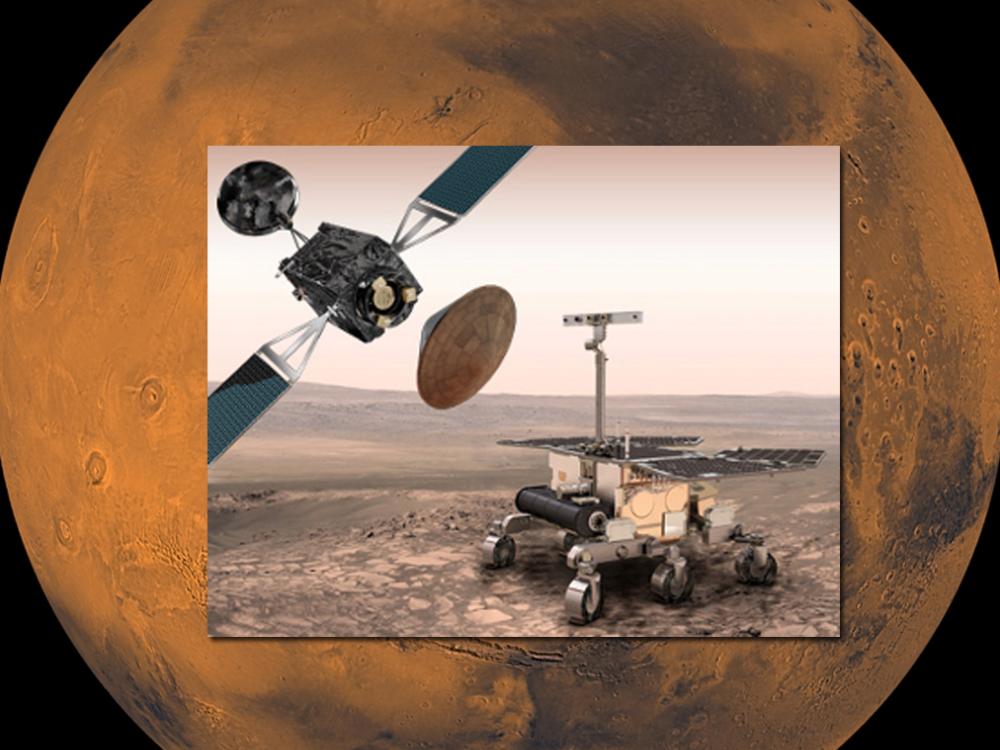 Artist concept displaying all three components of a Mars exploration program. A rover, orbiter with a box-shaped base and solar panels on two sides, and conic-shaped landing module are all present in the concept.